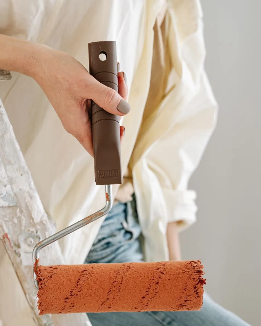 Painting a wall with a roller